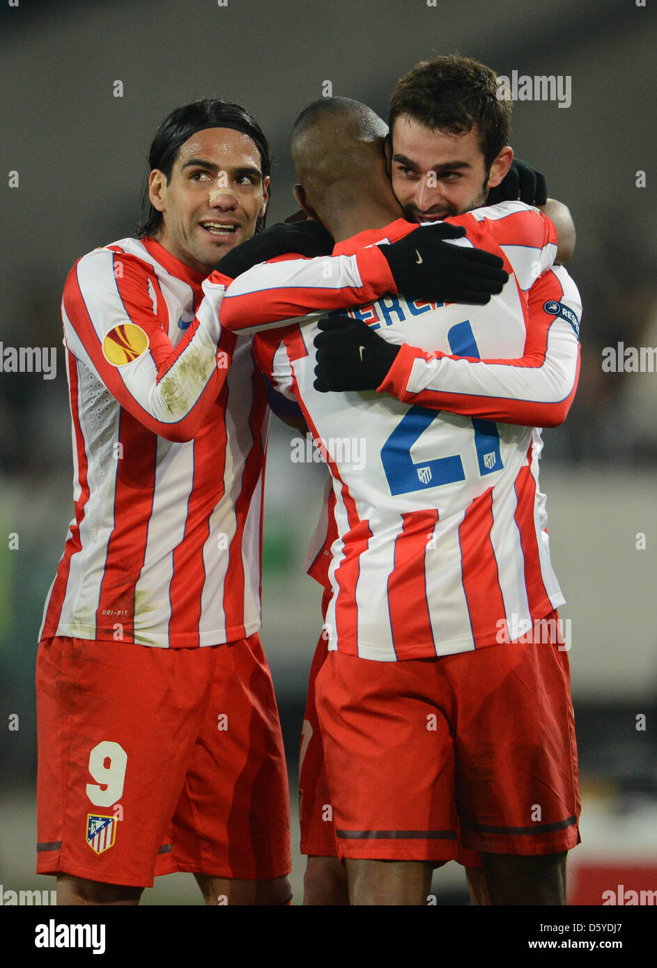 Atletico Madrid's Adrian (R) celebrates with Luis Perea (C) and Falcao after scoring the 1-0 during their UEFA Europa League quarter-final first leg soccer match between Hanover 96 and Atletico Madrid at AWD-Arena in Hanover, Germany, 05 April 2012. Photo: Peter Steffen dpa/lni  +++(c) dpa - Bildfunk+++ Stock Photo