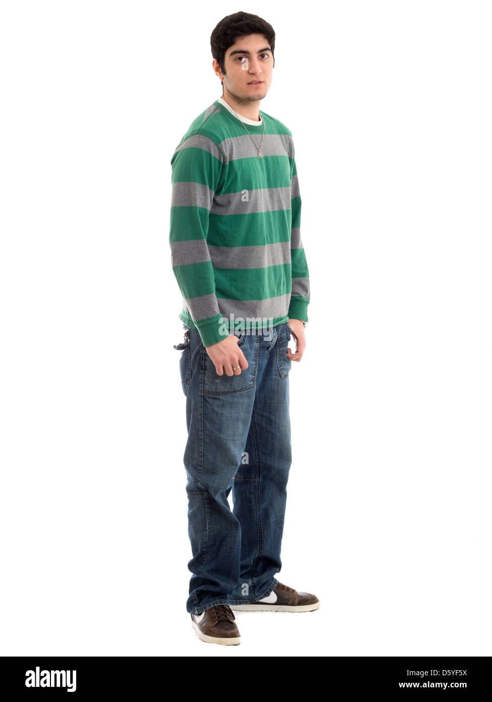 Full length portrait of young man with hands in pockets isolated on white background Stock Photo