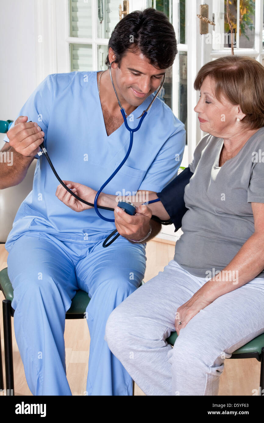 Doctor taking the Blood Pressure Stock Photo Alamy