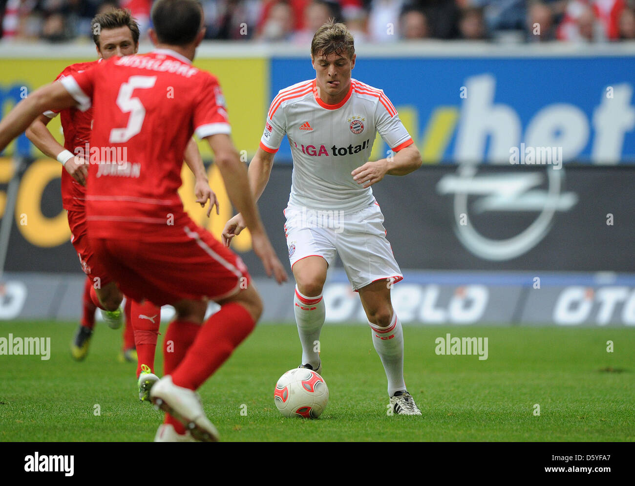 Munich's Toni Kroos (R) vies for the ball with Duesseldorf's Juanan during the German Bundesliga match between Fortuna Duesseldorf vs. FC Bayern Munich at Esprit Arena in Duesseldorf, Germany, 20 October 2012. Photo: Jonas Guettler Stock Photo