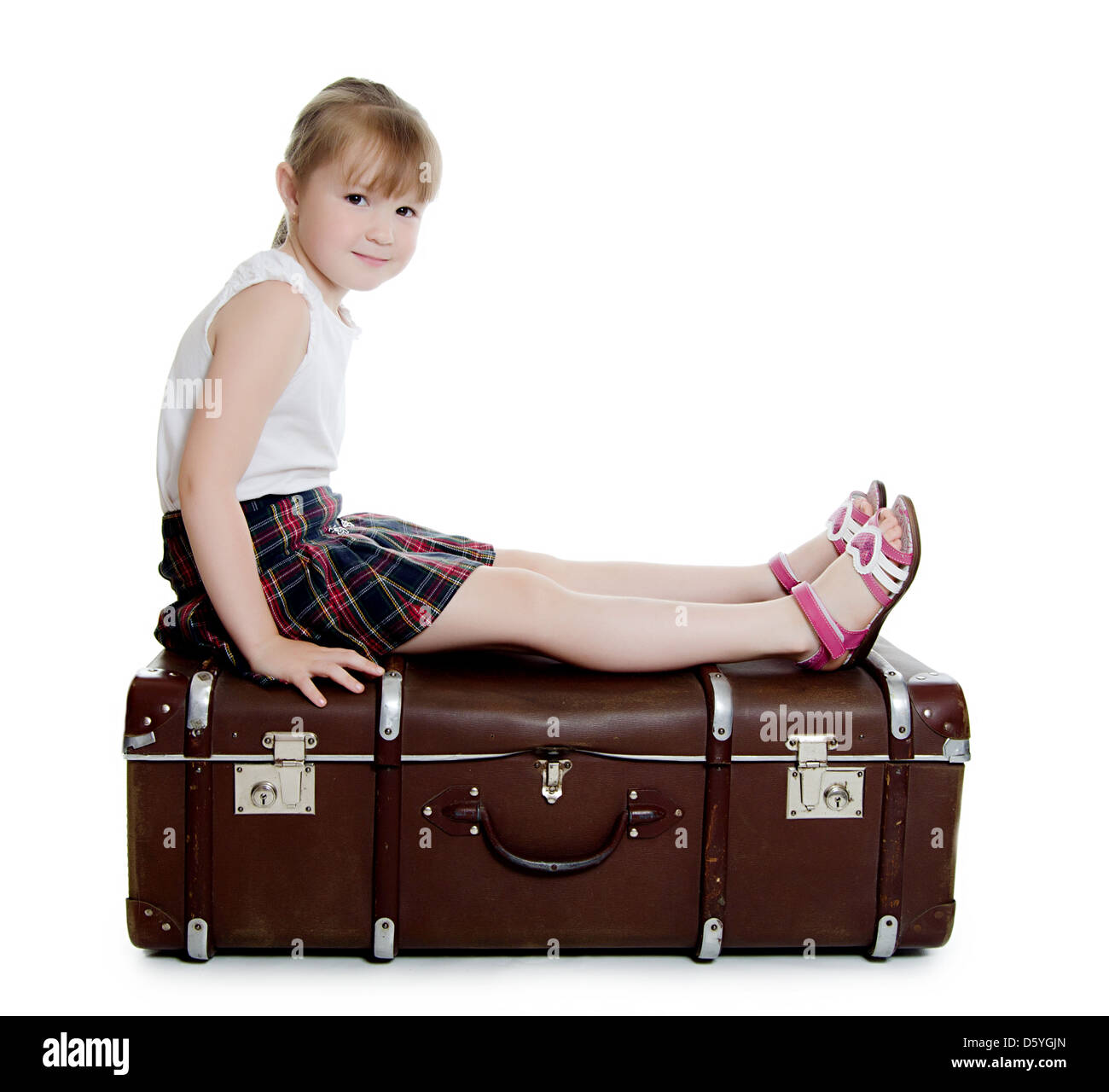 The little girl on old suitcases Stock Photo Alamy