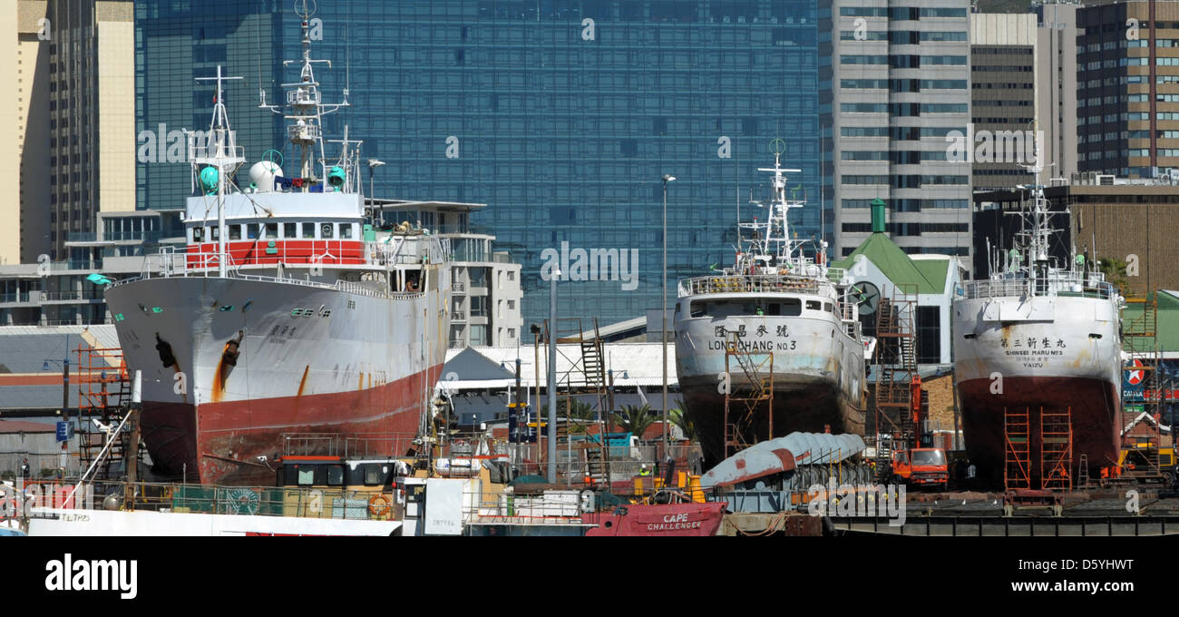 Fishing ships sit in a dry dock at the harbor basin of V&A Waterfront in Cape Town, South Africa, 11 October 2012. The international conference of the INternation Maritime Organisation for security on fishing ships with 58 countries takes place in Cape Town from 09 until 11 October. Photo: Ralf Hirschberger Stock Photo