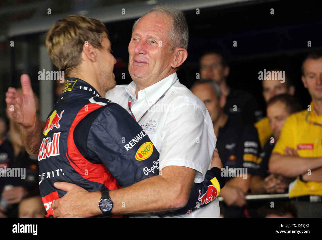 German Formula One driver Sebastian Vettel of Red Bull celebrates with the chief motorsport of Red Bull, Austrian Helmut Marko, after winning the Formula One Grand Prix of India at the race track Buddh International Circuit, Greater Noida, India, 28 October 2012. Photo: Jens Buettner/dpa  +++(c) dpa - Bildfunk+++ Stock Photo