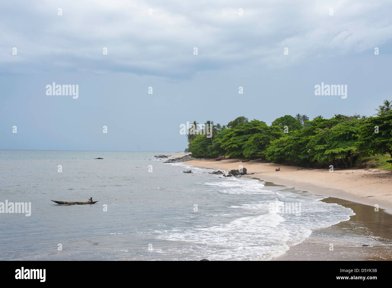 Pirogue with African fisherman heading out from African beach in ...