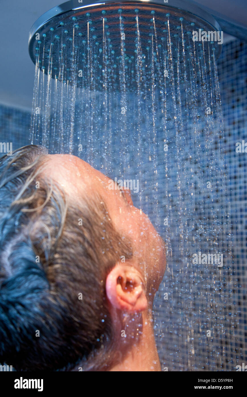 Man taking shower hires stock photography and images Alamy