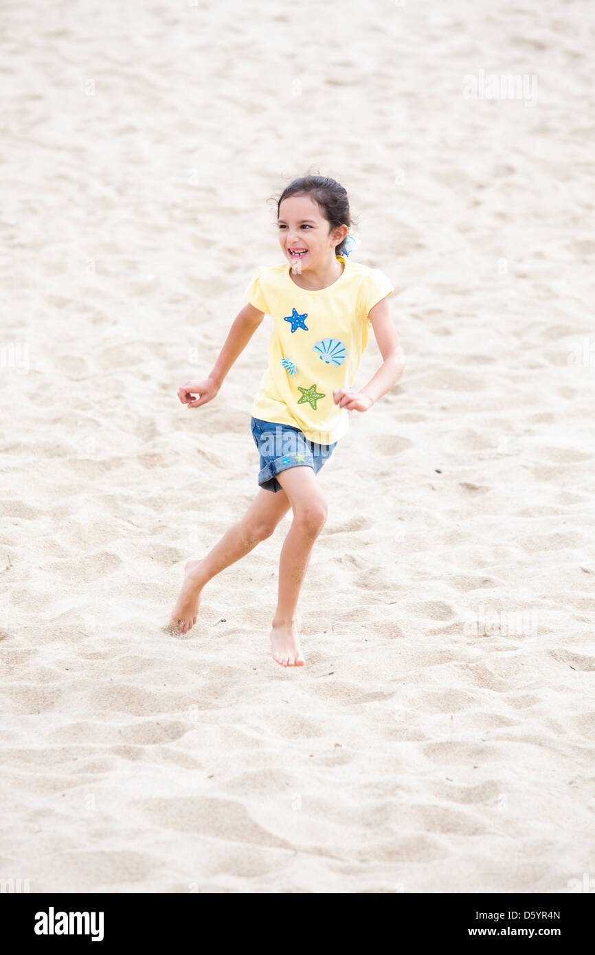 Girl Running on Beach Stock Photo Alamy