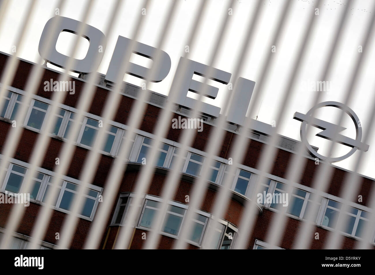 The logo of car manufacturer Opel towers on top of the central building