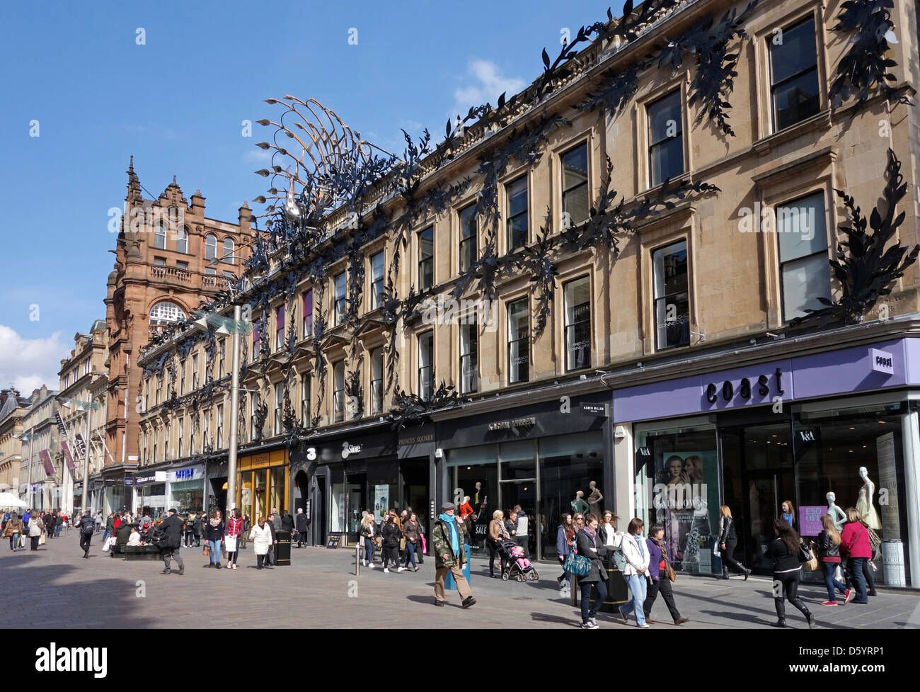 Shoppers and visitors in Buchanan Street at the Princes Square entrances in Glasgow Scotland on a sunny spring day Stock Photo