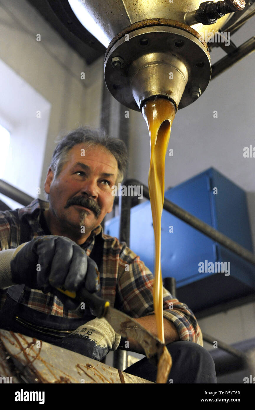 An employee of the Shellack factory SBB is pictured in Bremen, Germany ...