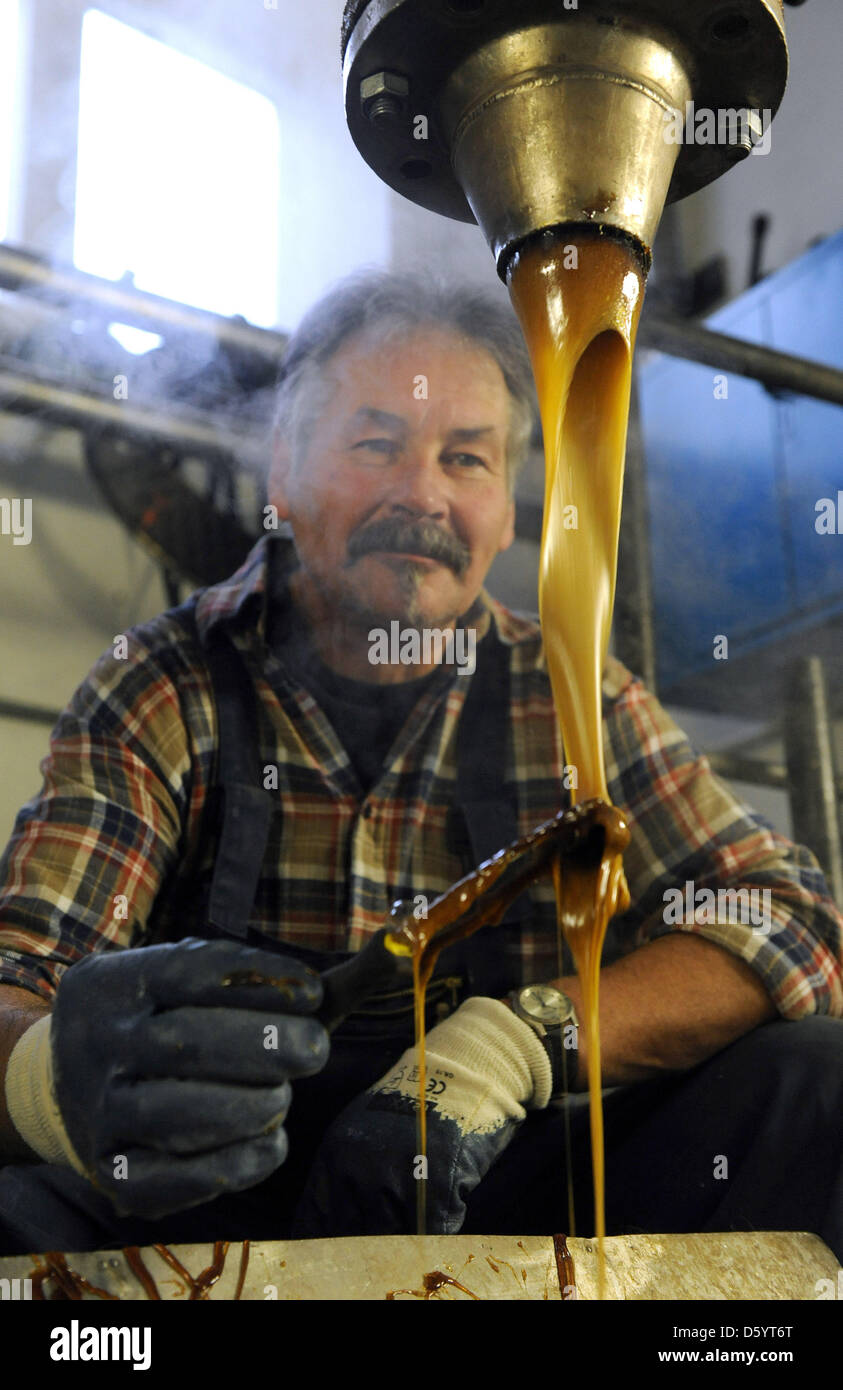 An employee of the Shellack factory SBB is pictured in Bremen, Germany ...