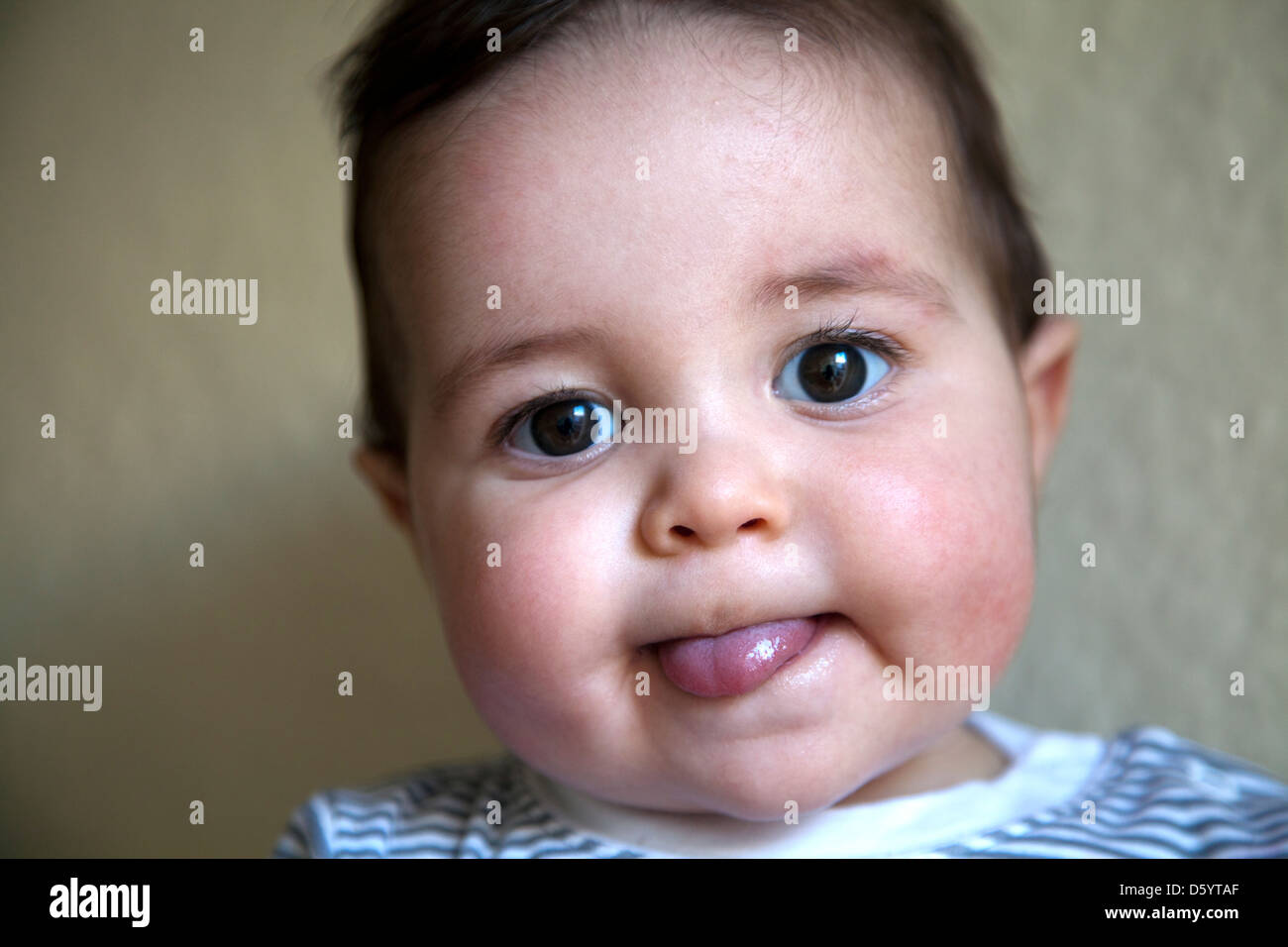 Baby sticking out tongue funny hires stock photography and images Alamy