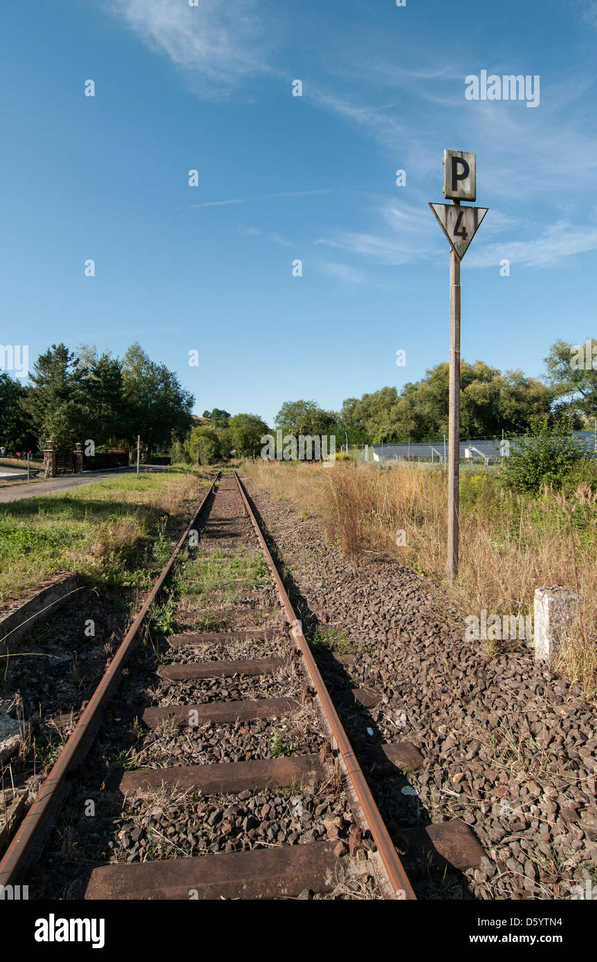Railway track with sign Stock Photo - Alamy