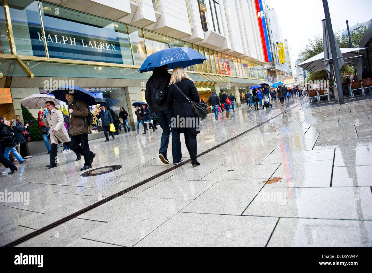 Germany Raintown People in rainwear on a street in Franfurt, Germany, 03 November 2012 ...