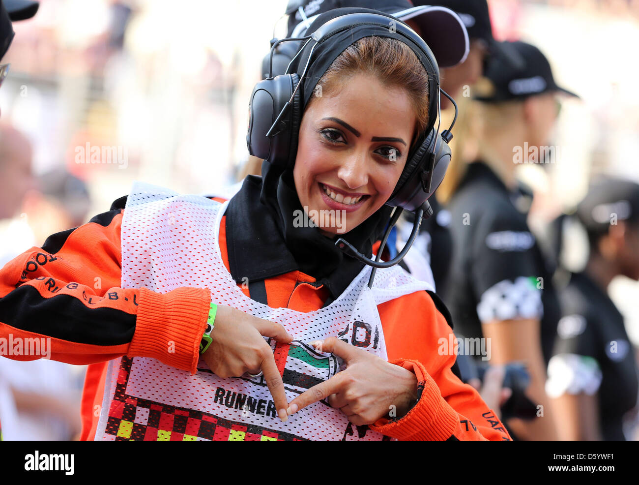 A marshal is seen during the driver's parade before the start of the Formula One Grand Prix of Abu Dhabi at the Yas Marina Circuit in Abu Dhabi, United Arab Emirates, 04 November 2012. Photo: Jens Buettner/dpa  +++(c) dpa - Bildfunk+++ Stock Photo