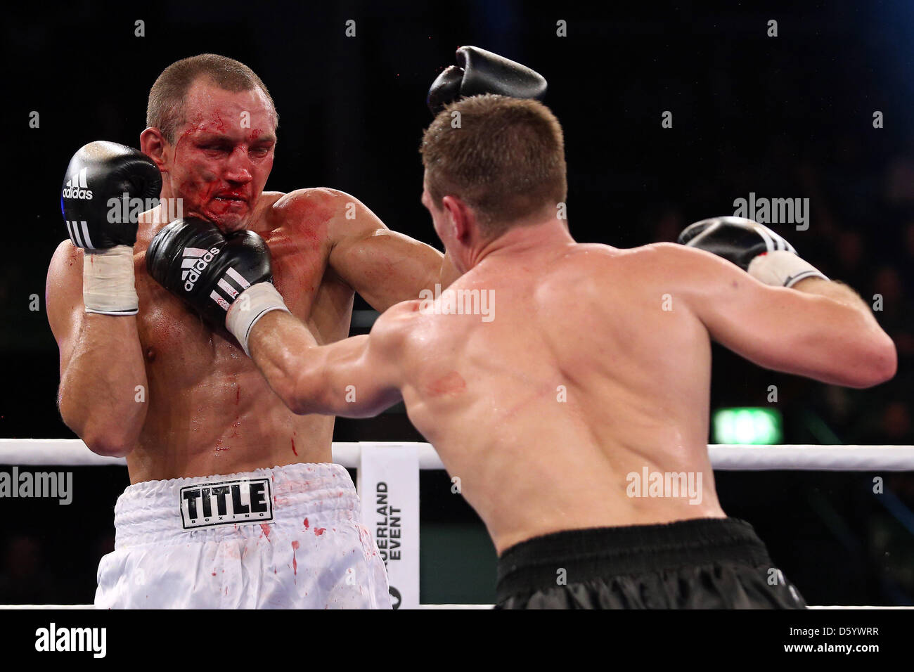 Italian light heavyweight boxer Serhiy Demchenko (L) fights against