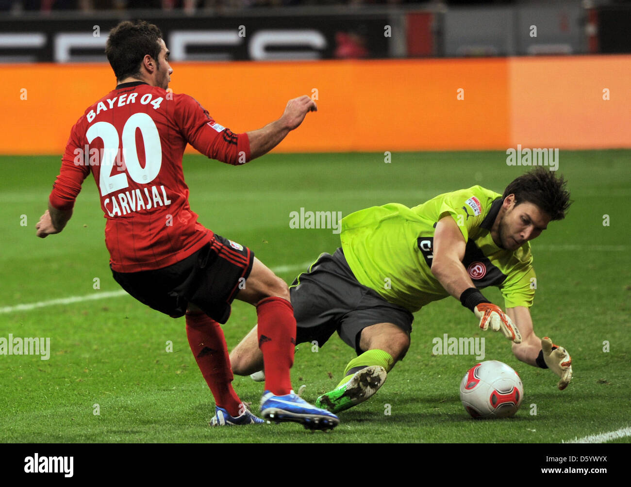 Leverkusen's Daniel Carvajal (L) vies for the ball with Duesseldorf's goalkeeper Fabian Giefer  during the German Bundesliga match between Bayer Leverkusen and Fortuna Duesseldorf at BayArena in Leverkusen, Germany, 04 November 2012. Photo: DANIEL NAUPOLD  (ATTENTION: EMBARGO CONDITIONS! The DFL permits the further  utilisation of up to 15 pictures only (no sequntial pictures or vi Stock Photo