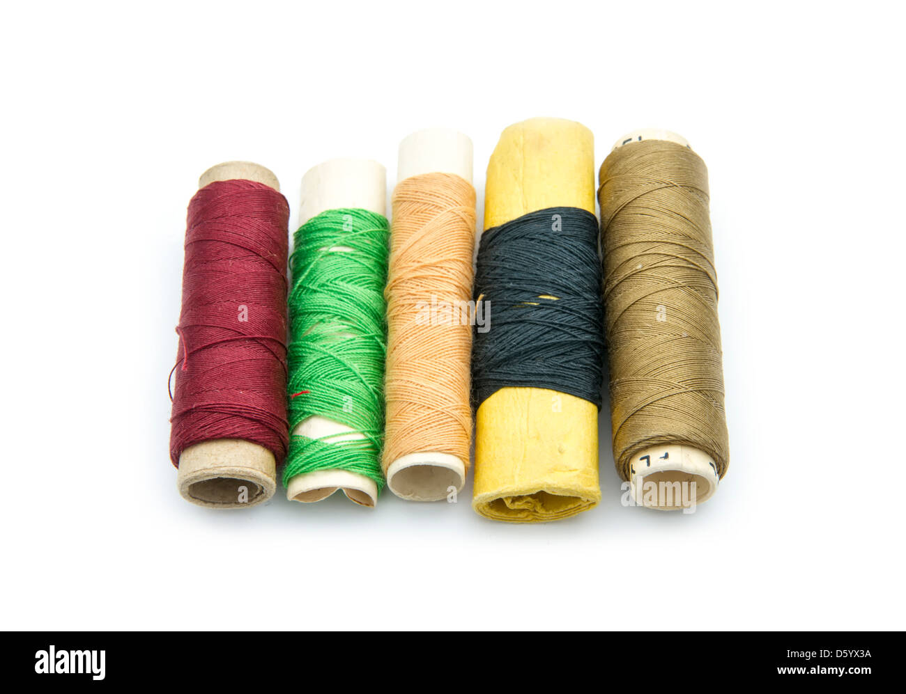 old thread spools isolated on white background Stock Photo