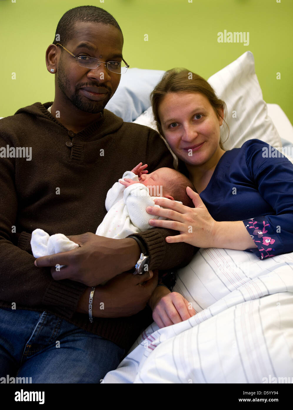 Mother Anne-Cecile and father Luc Richol hold their newbord child Matteo  Noah Richol in their hospital room at the Clinic for Gynaecology and  Obstetrics at the University Hospital in Dresden, Germany, 06