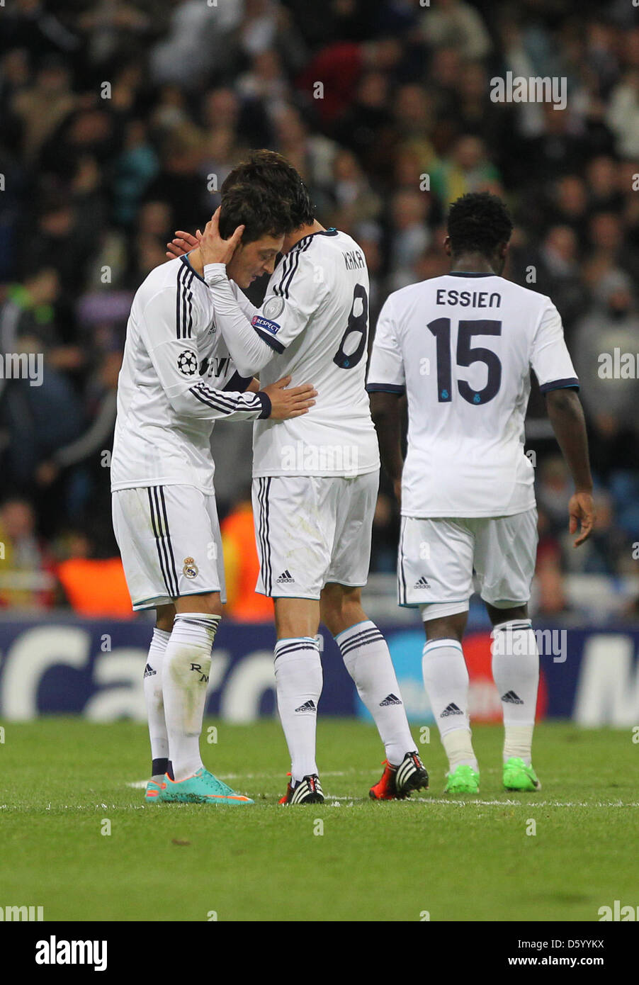 Real Madrid's Mesut Oezil (l) celebrates his 2-2 with Kaka (C) and Michael Essien during the Champions League Group D soccer match between Real Madrid and Borussia Dortmund at the Santiago Bernabeu Stadium in Madrid, Spain, 6 November 2012. Photo: Fabian Stratenschulte/dpa  +++(c) dpa - Bildfunk+++ Stock Photo