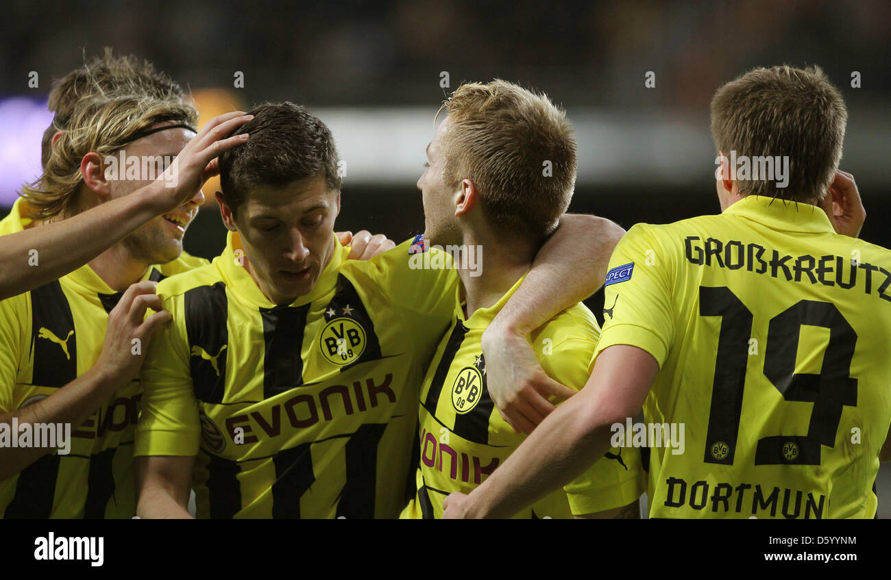 Dortmund's Marco Reus (2-R) celebrates his 1-0 goal with Marcel Schmelzer, Robert Lewandowski and Kevin Grosskreutz (L-R) during the Champions League Group D soccer match between Real Madrid and Borussia Dortmund at the Santiago Bernabeu Stadium in Madrid, Spain, 6 November 2012. Photo: Fabian Stratenschulte/dpa Stock Photo