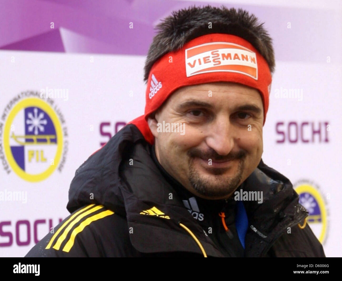 German luge national coach Georh Hackl smiles during an interview