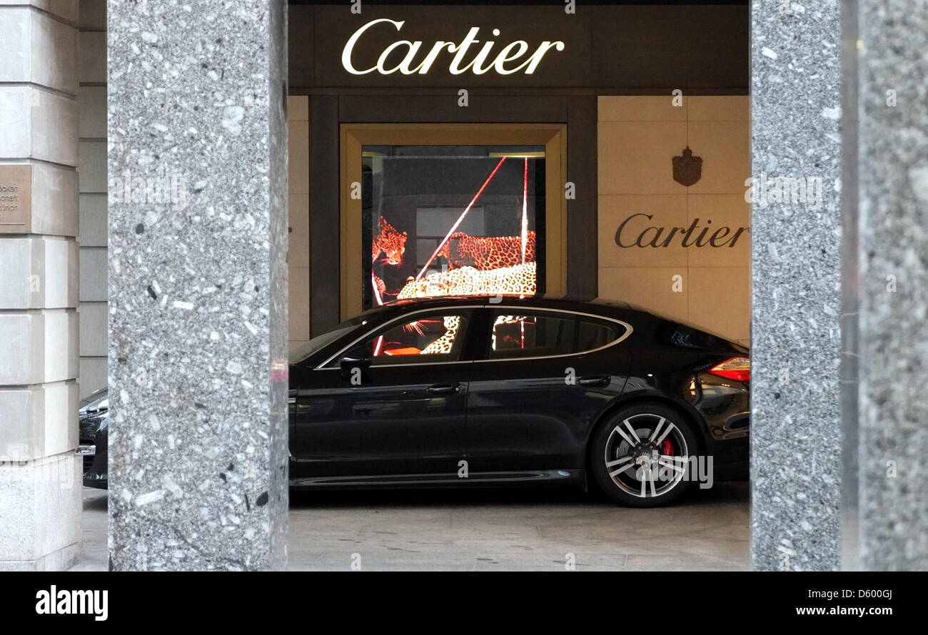 A Porsche Panamera is pictured before a Cartier branch store in