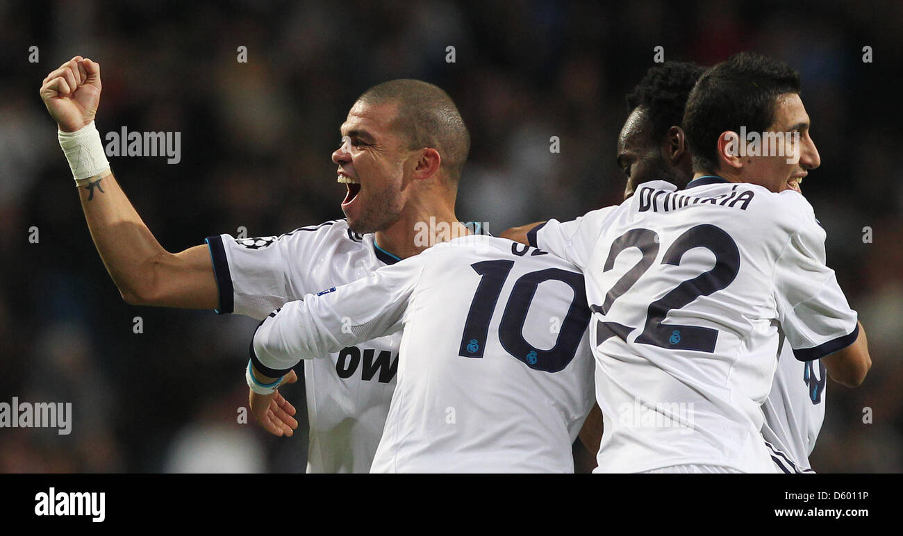 Real Madrid's Mesut Oezil (2nd left) celebrates his 2:2-goal with Pepe, Michael Essien and Angel Di Maria (l-r) during the Champions League Group D soccer match between Real Madrid and Borussia Dortmund at the Santiago Bernabeu Stadium in Madrid, Spain, 6 November 2012. The match ended 2:2. Photo: Fabian Stratenschulte/dpa Stock Photo