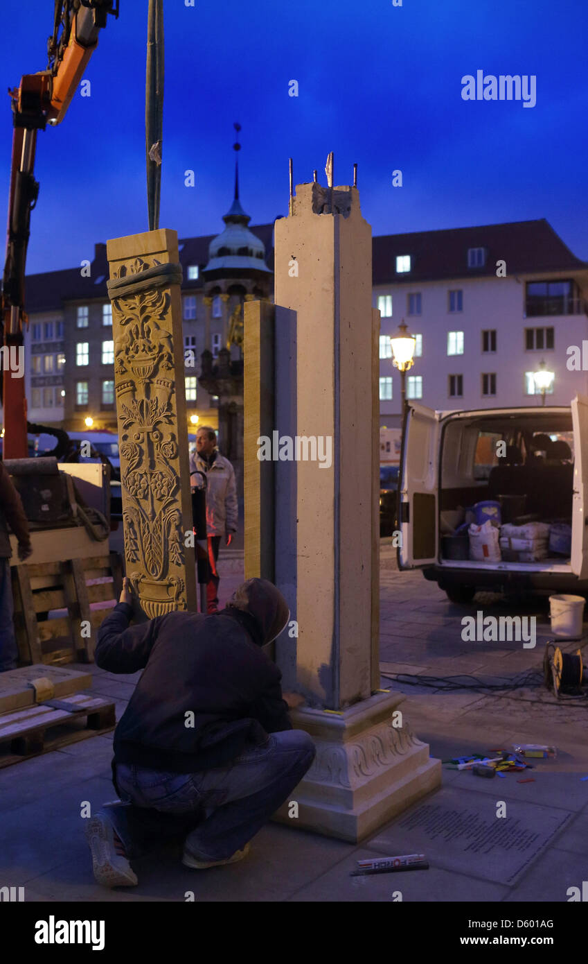 A relief panel made from sandstone is attached to the plinth for the bronze statue 'Hirsch' (Stag) on the Alte Markt square in Magdeburg, Germany, 08 November 2012. The ceremonial unveiling of the figure will take place on 09 November 2012. The historic column was destroyed in 1631 during the 30 years war and is one of the three most important artworks from the middle ages on Markt Stock Photo