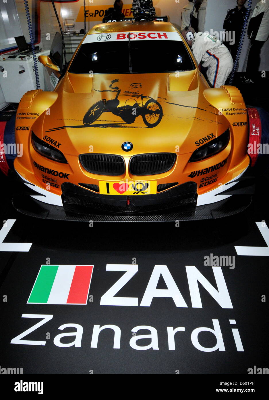 The refitted DTM race car of Italian racecar driver Alessandro Zanardi sits in a pit at the Nuerburgring, Germany, 08 November 2012. Zanardi lost both of his legs during an accident in 2001, won two gold medals at the Paraolympics in London, and is testing with BMW on the Nuerburgring now. Photo: MAXIMILIAN HAUPT Stock Photo