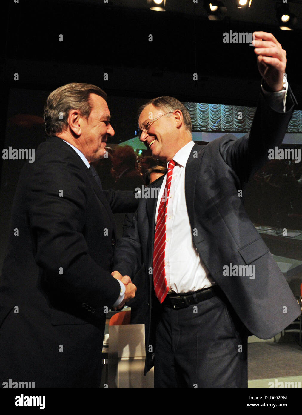 The SPD top candidate for the upcoming state parliament election in Lower Saxony, Stephan Weil (r), greets former Gemany chancellor Gerhard Schroeder (l) during the state party meeting of the Lower Saxonian Social Democrats in Wolfsburg, Germany, 10 November 2012. Two months before the elections, the party will agree on their electoral program. Photo: JOCHEN LUEBKE Stock Photo