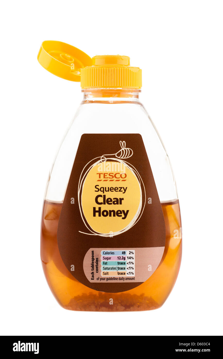 Half used Tesco plastic squeezy clear honey flip top container Stock Photo