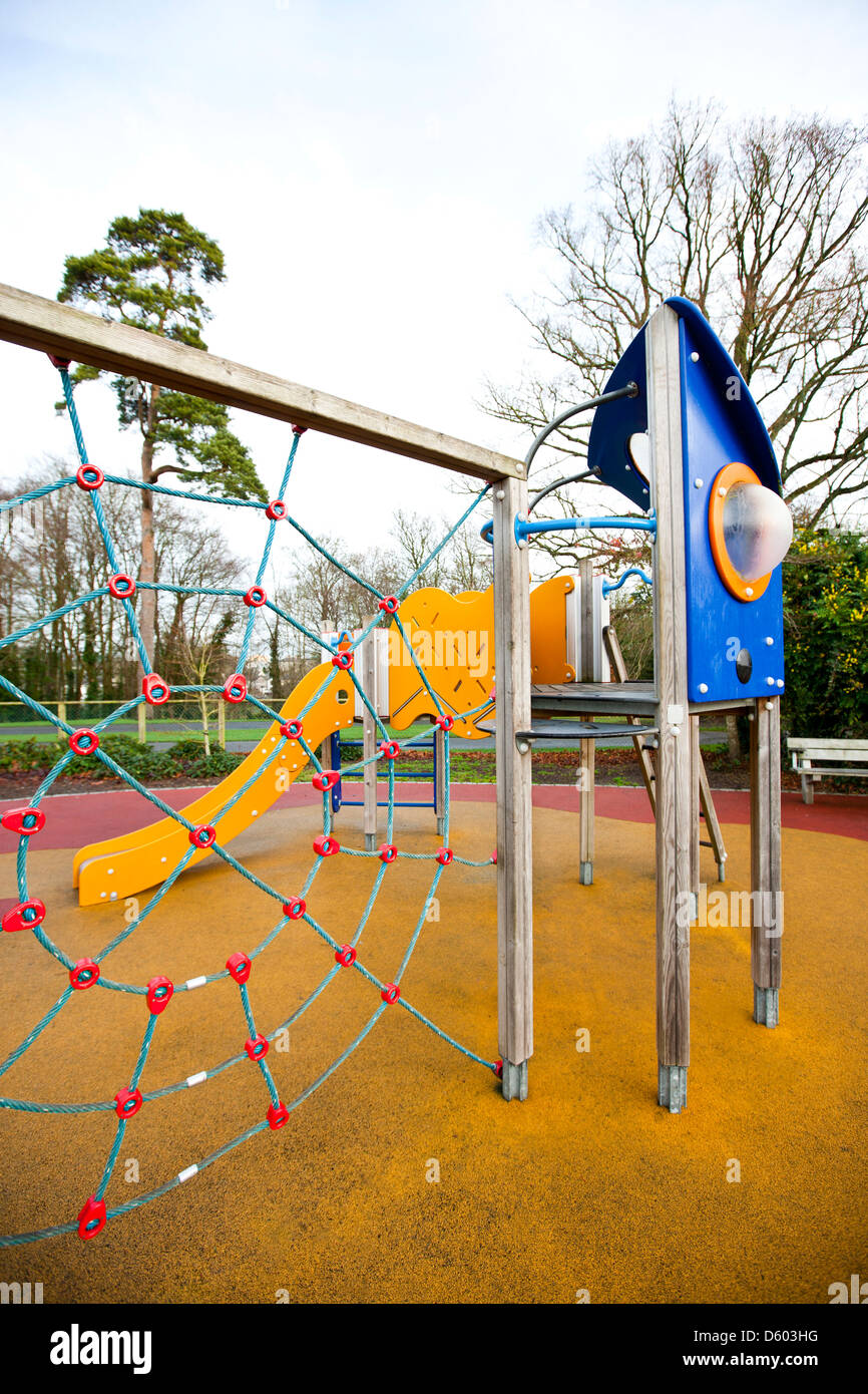 Climbing web with slide in background Stock Photo Alamy