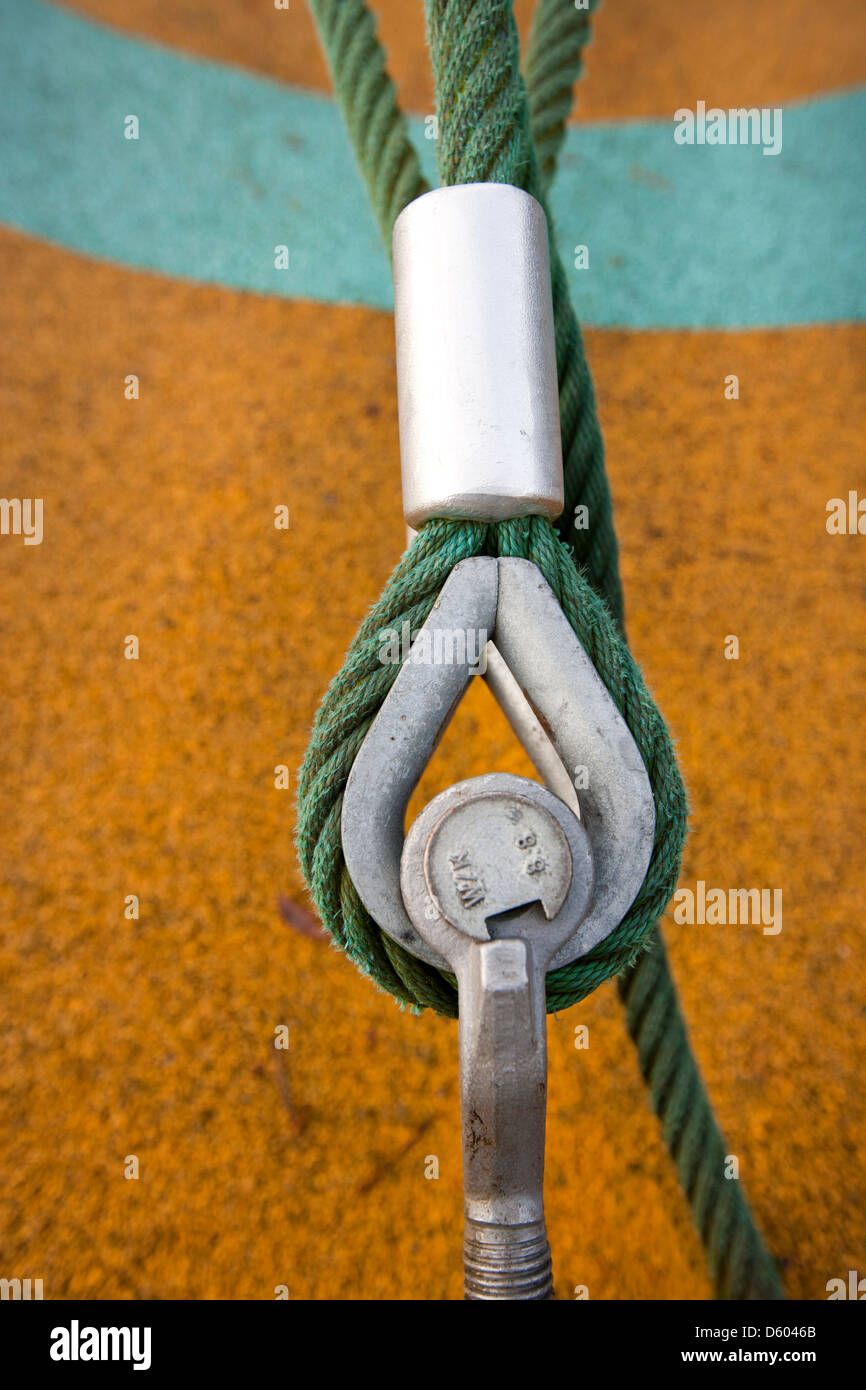 Eye bolt secures cable the ground Stock Photo