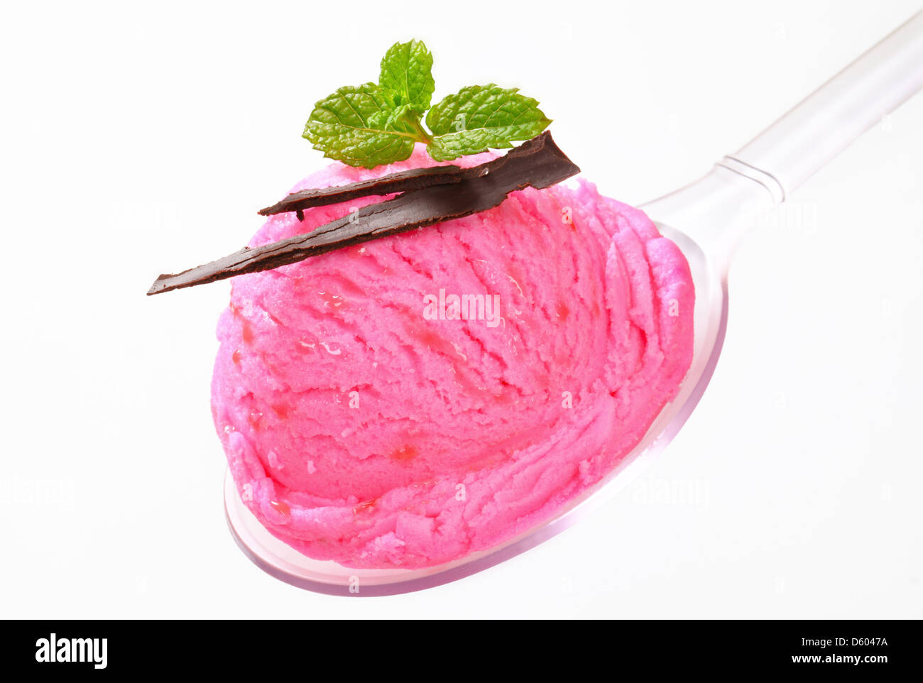 Scoop of pink ice cream on a plastic spoon Stock Photo