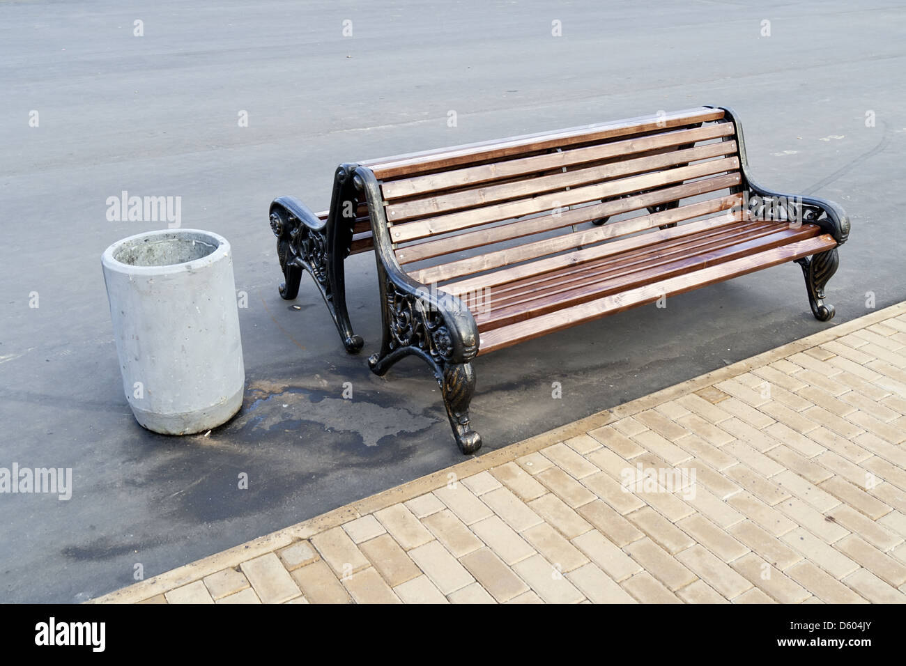 a bench to rest in a public city park Stock Photo