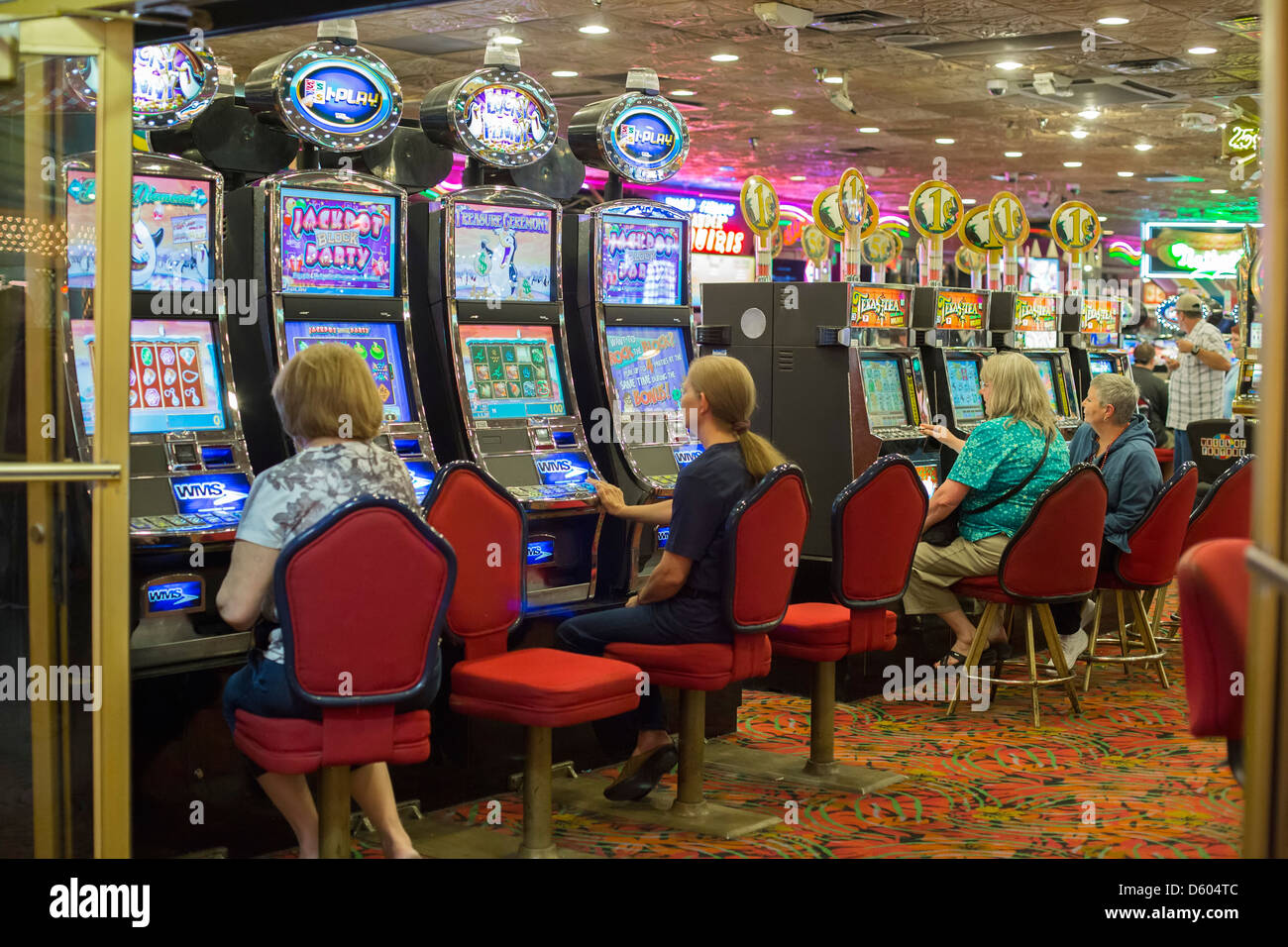 Las Vegas, NV, USA - 13th July 2013: People Playing Slot Machine Games  Inside Las Vegas Casino. Stock Photo, Picture and Royalty Free Image. Image  26254649.