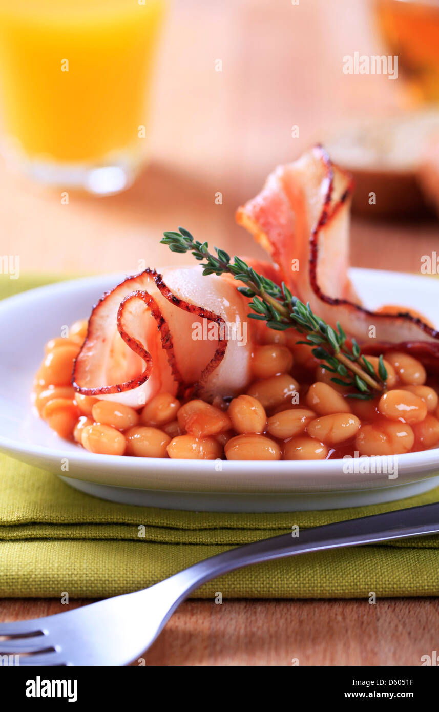 Breakfast of baked beans and bacon Stock Photo