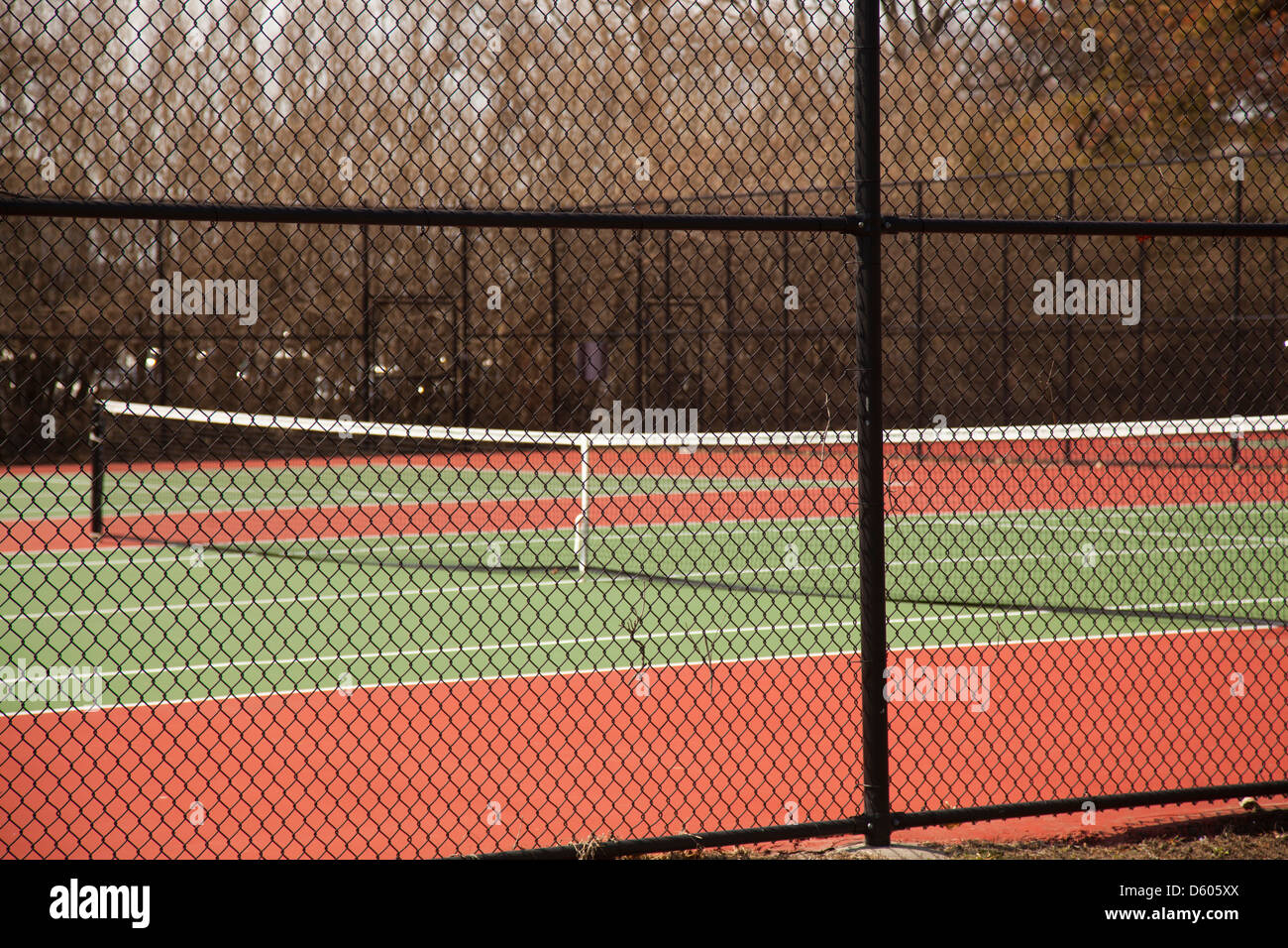clay tennis courts with fence Stock Photo