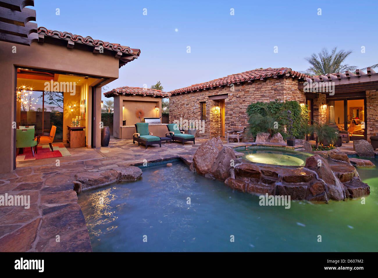 House Exterior with swimming pool hot tub Stock Photo