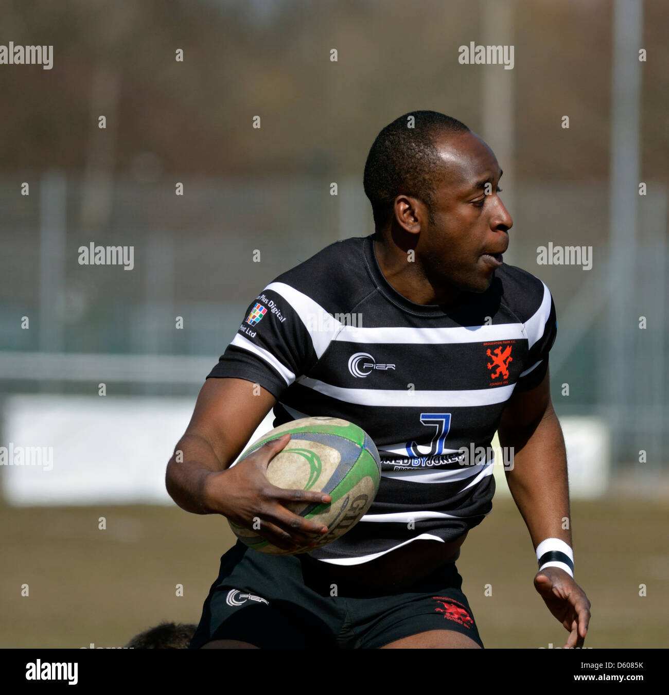 a broughton park player runs with the ball in the rugby union match between broughton park and hoylake Stock Photo