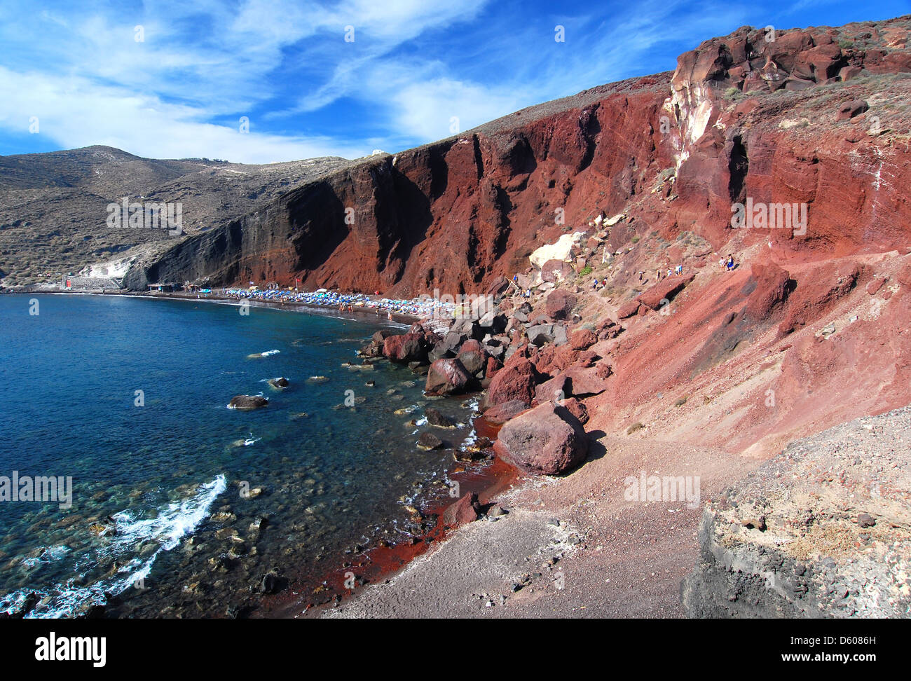 Red beach is one of the most beautiful and famous beaches of Santorini. Black and red volcanic pebbles and hot water. Greece Stock Photo