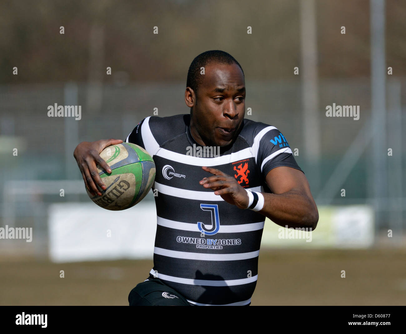 a broughton park player runs with the ball in the rugby union match between broughton park and hoylake Stock Photo