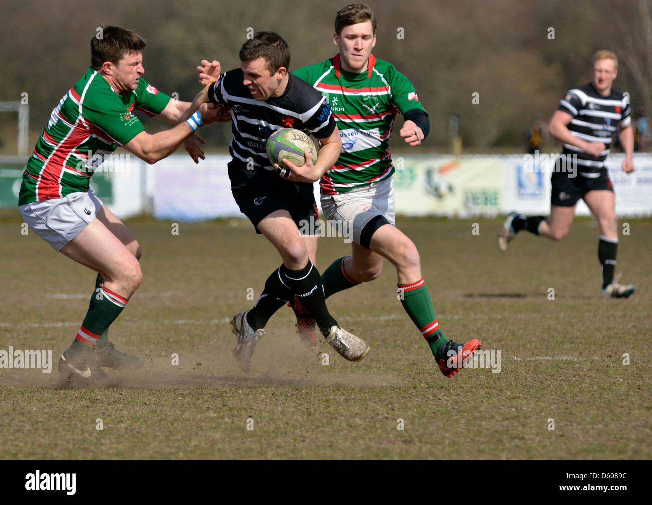 a broughton park player hilds off an opponent in the rugby union match between broughton park and hoylake Stock Photo