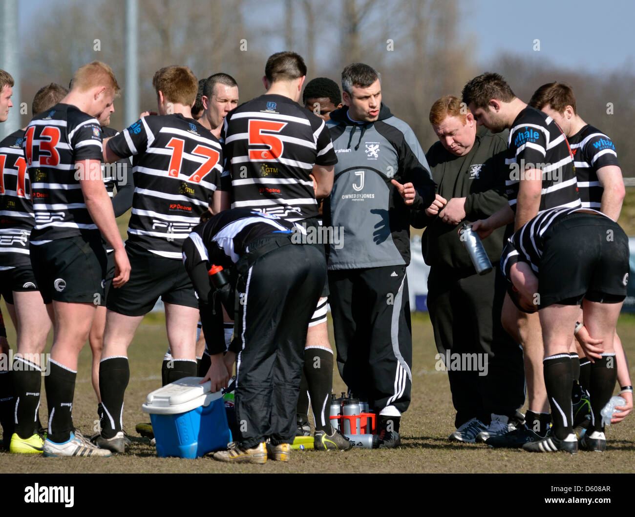 half-time talk by the coach in the rugby union match between broughton park and hoylake Stock Photo