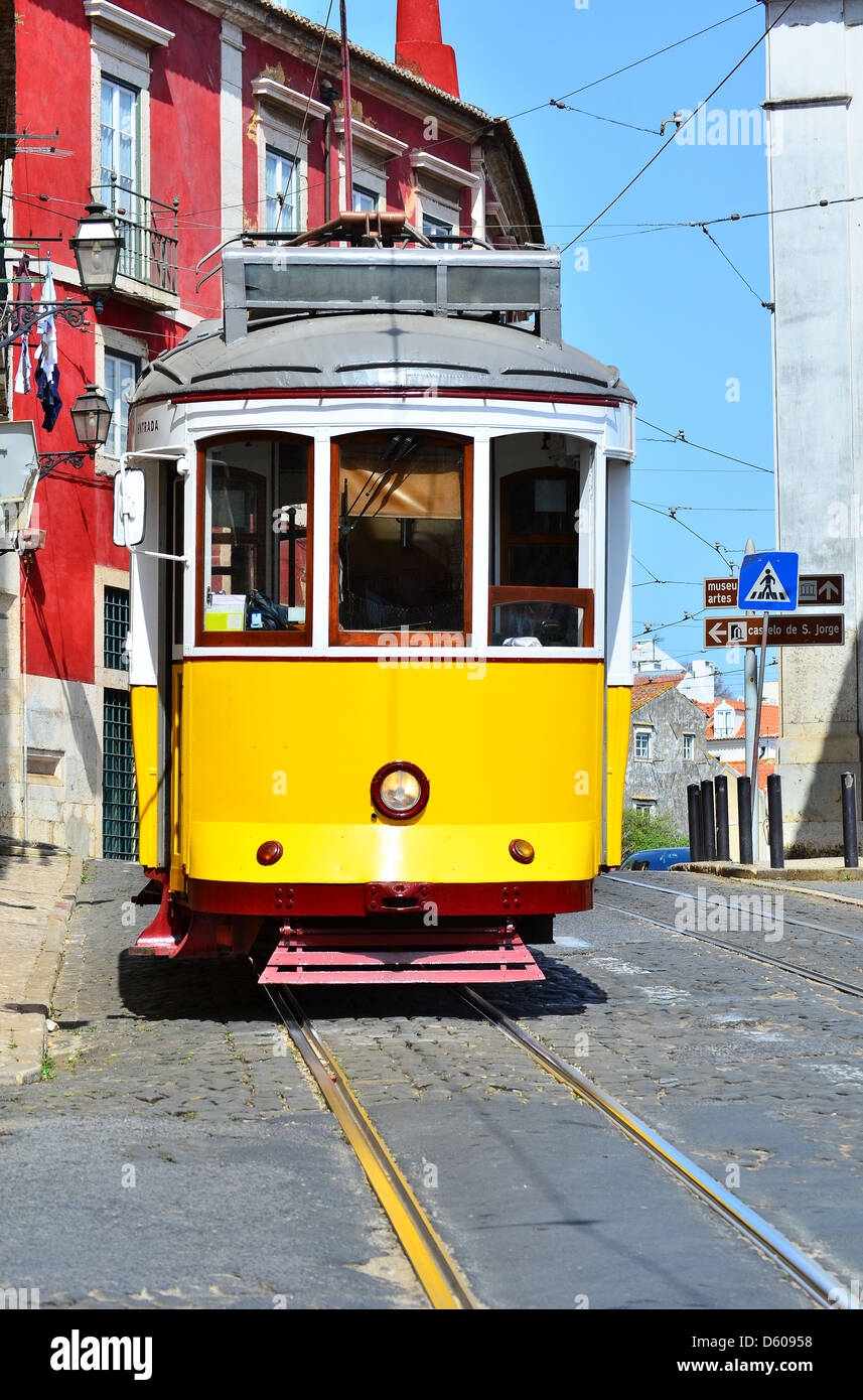 Yellow tram in Alfama district of Lisbon, Portugal symbol Stock Photo