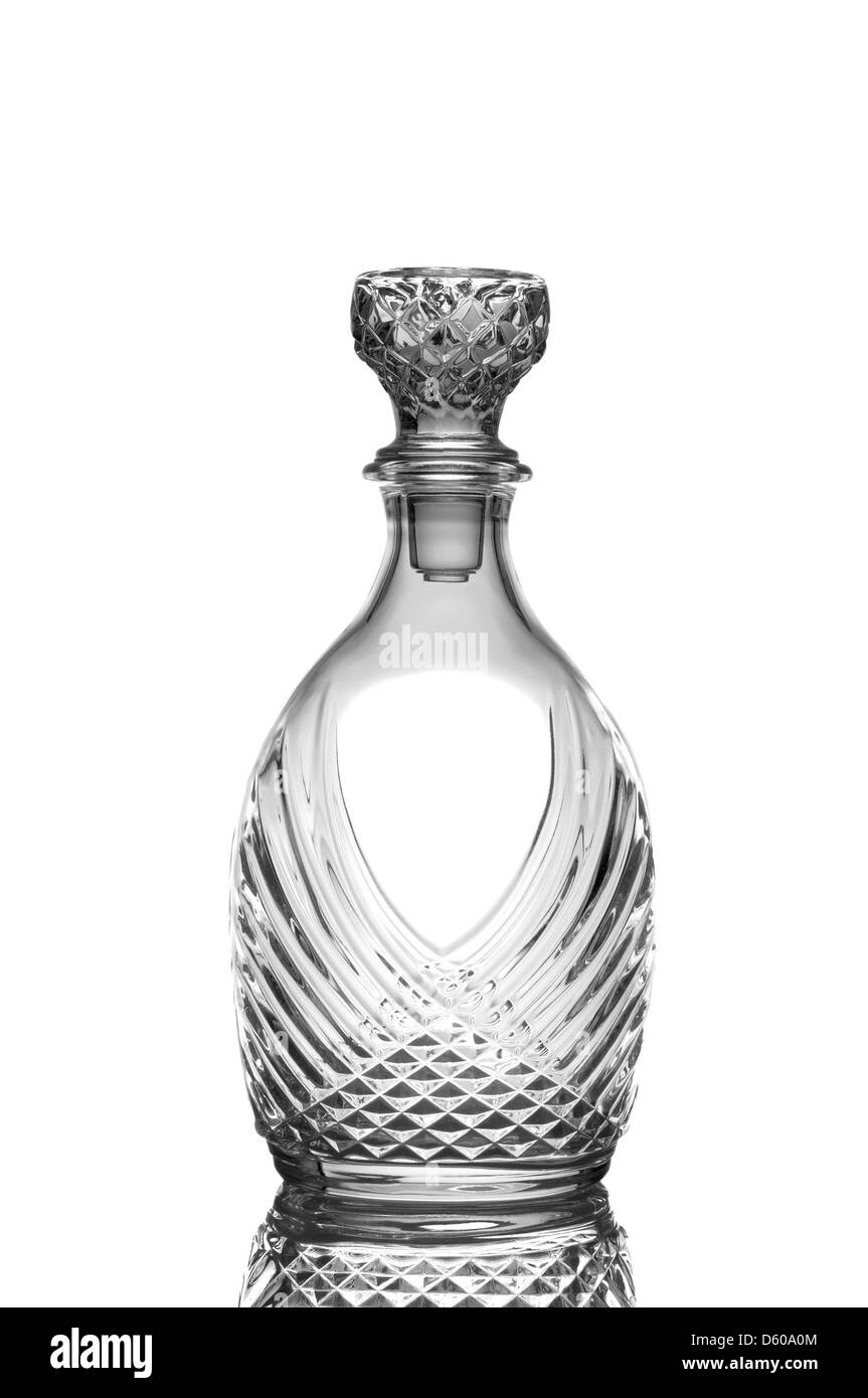 Closeup of a cut crystal whiskey decanter isolated on white with reflection. Stock Photo