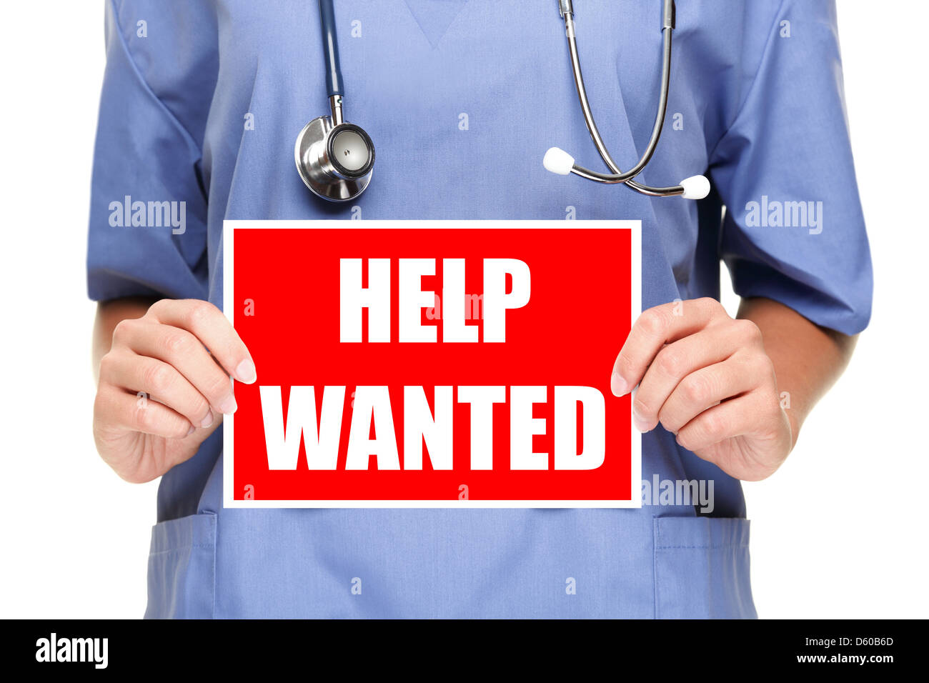 Mid section of medical doctor or nurse showing help wanted sign