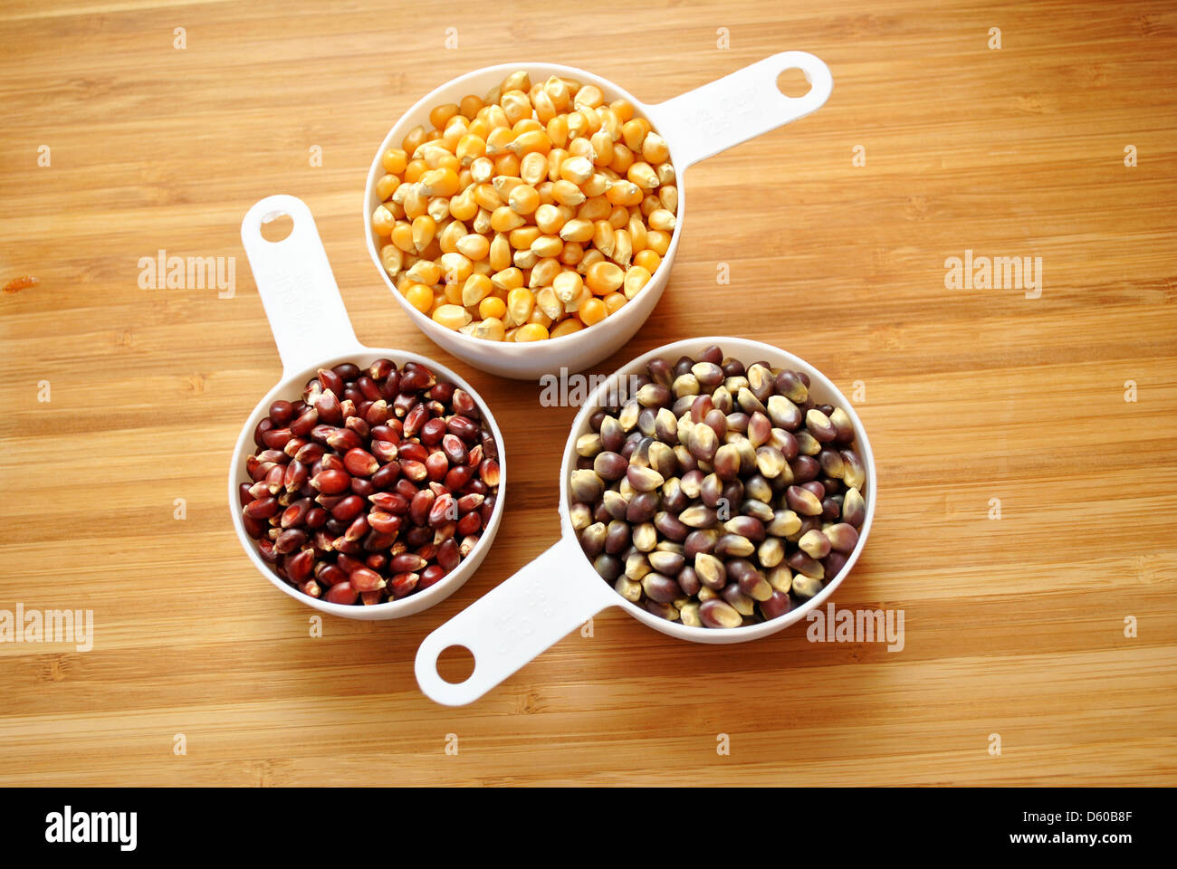 Three Cups of Popcorn Kernels Stock Photo Alamy