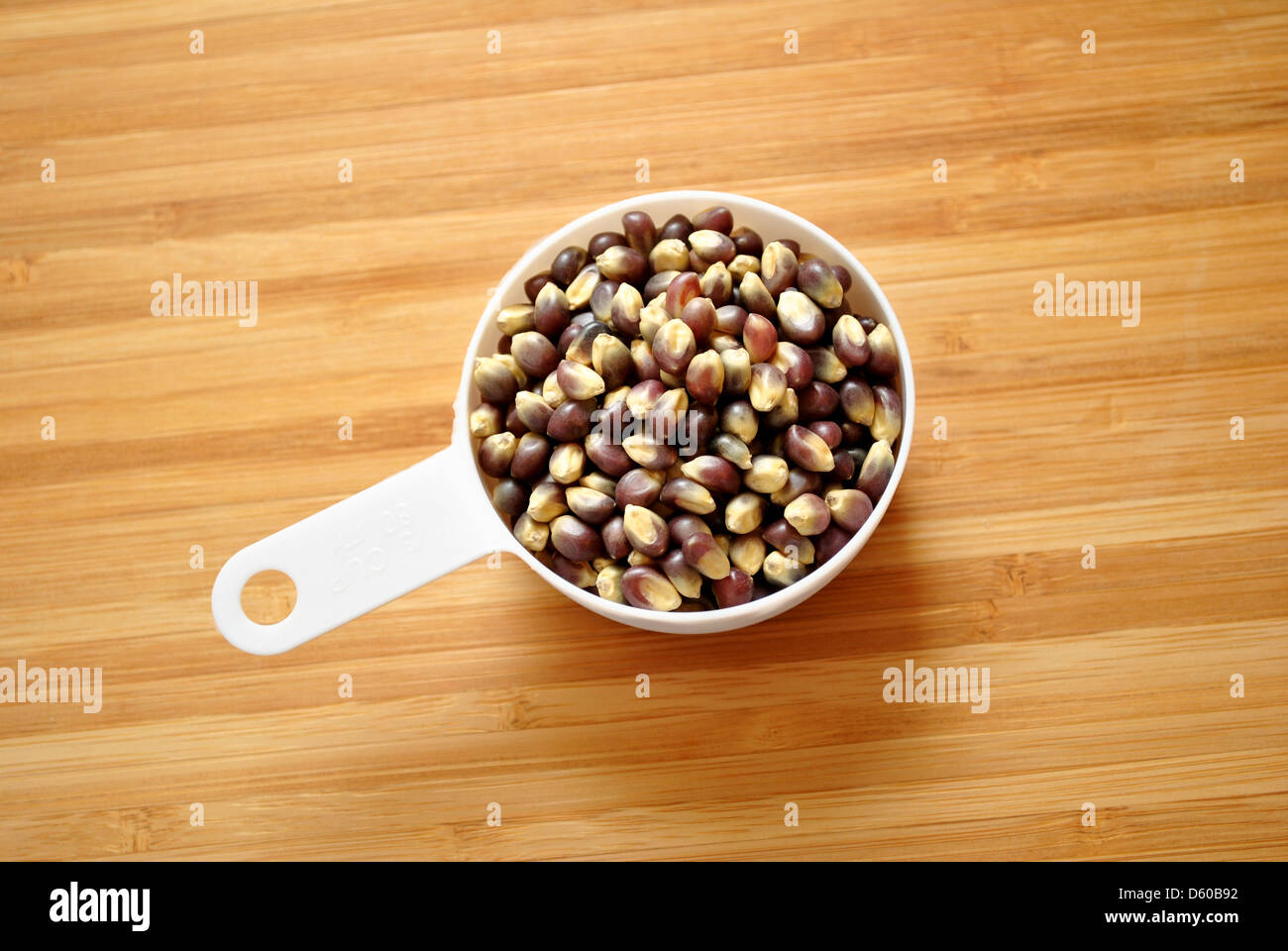 Blue Popcorn Kernels in a Measuring Cup Stock Photo Alamy