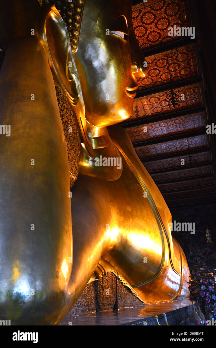 Reclining gold Buddha Thailand Stock Photo